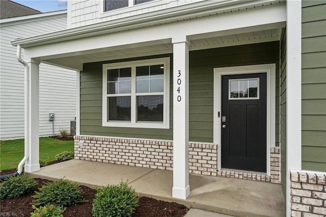 doorway to property with a porch