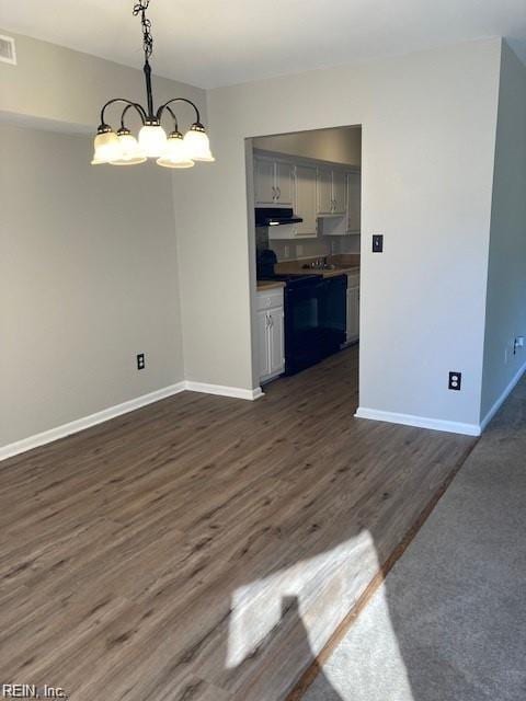 unfurnished dining area featuring dark hardwood / wood-style flooring