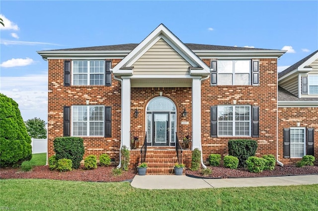 view of front of home featuring a front yard