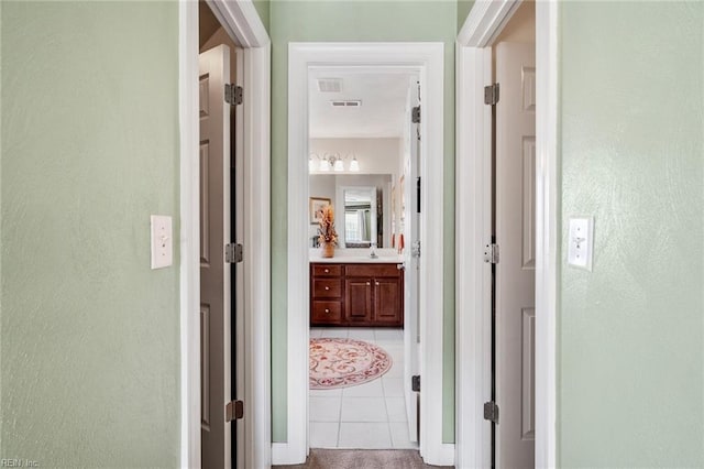 hallway featuring light tile patterned floors