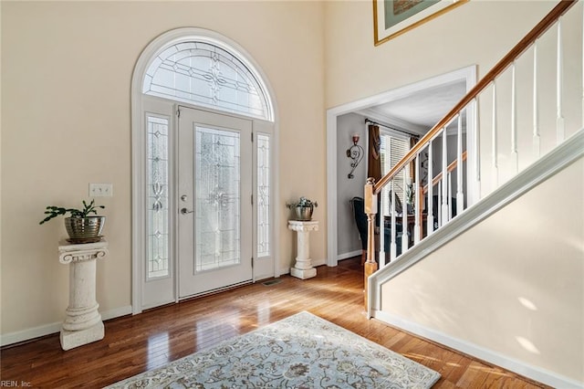 entryway with hardwood / wood-style floors