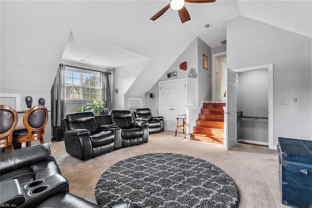 carpeted living room featuring ceiling fan and vaulted ceiling