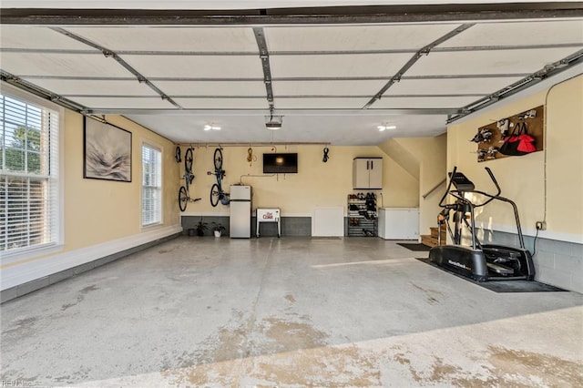 garage featuring white fridge