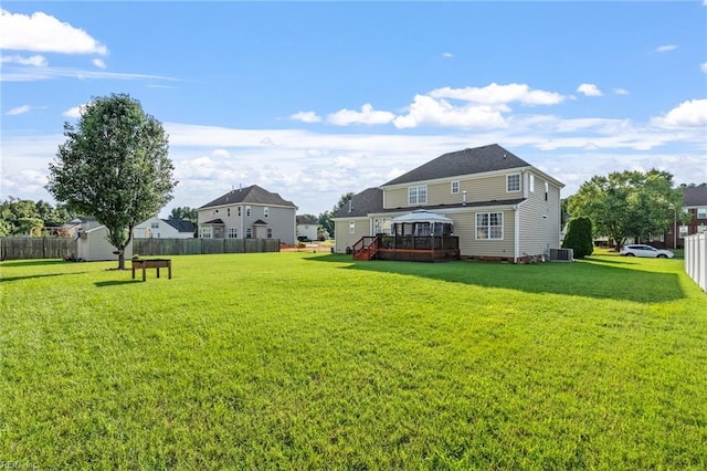 view of yard featuring a deck and cooling unit