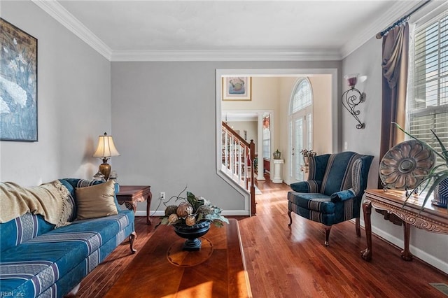 living room featuring ornamental molding, hardwood / wood-style flooring, and plenty of natural light