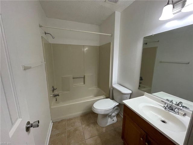 full bathroom with bathtub / shower combination, a textured ceiling, toilet, vanity, and tile patterned floors