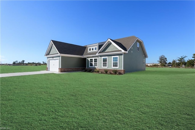 view of front facade featuring a front lawn and a garage