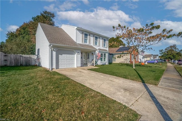 view of front of property featuring a front yard and a garage