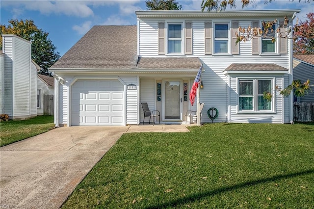 view of front facade featuring a front yard and a garage