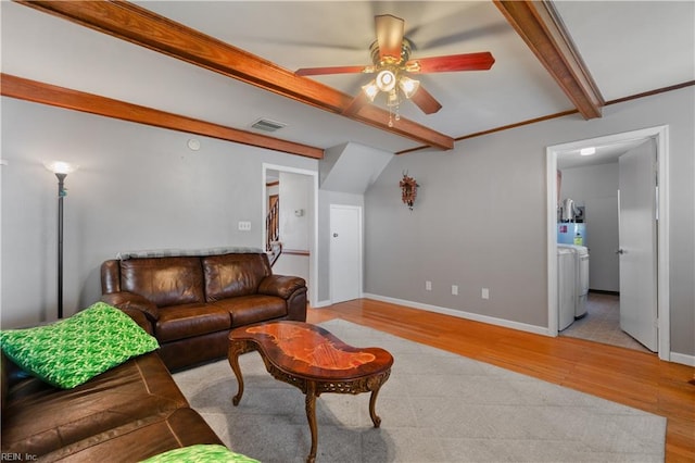 living room featuring beam ceiling, light wood-type flooring, and ceiling fan