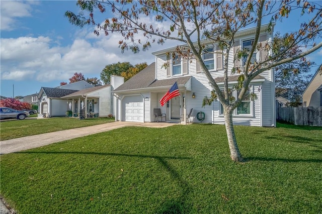 view of front of home with a front yard and a garage