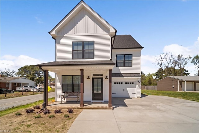 view of front of home with covered porch and a garage