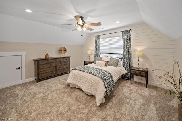 carpeted bedroom featuring vaulted ceiling and ceiling fan