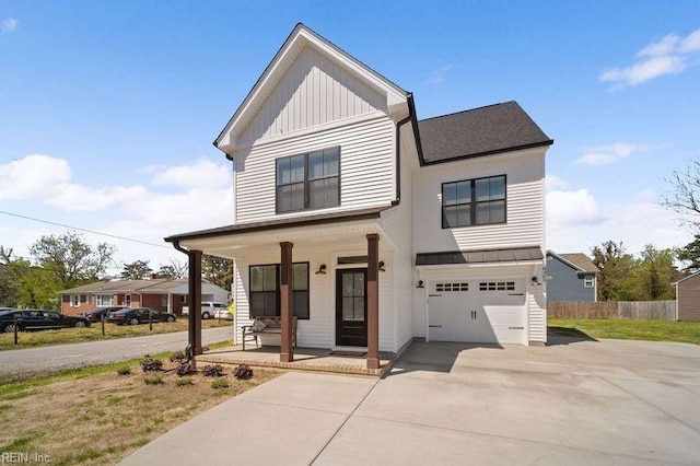 view of front of home with a porch and a garage