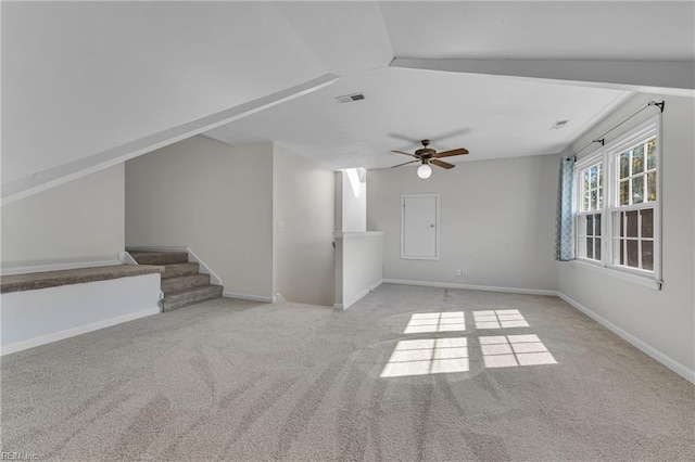 unfurnished living room with ceiling fan and light colored carpet