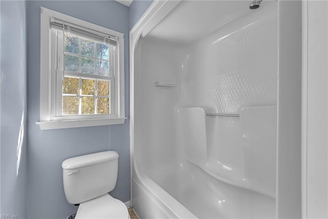 bathroom with toilet and shower / tub combination