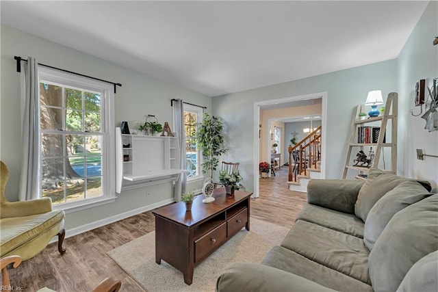 living room with a healthy amount of sunlight and light wood-type flooring