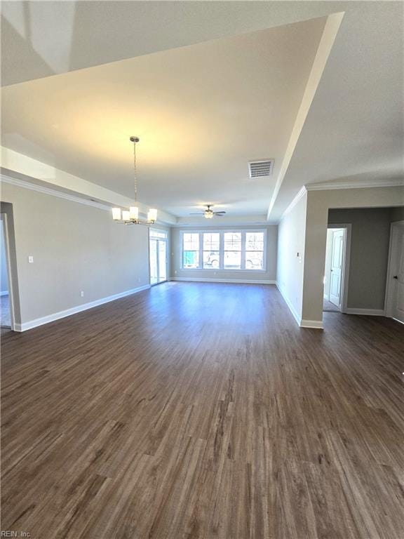 unfurnished living room featuring crown molding, dark wood-type flooring, and ceiling fan with notable chandelier