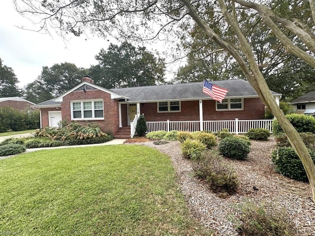 ranch-style house featuring a front yard and a garage