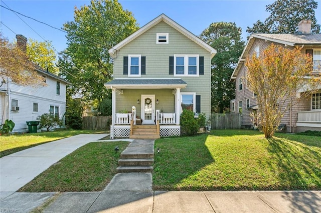 front of property with a front yard and a porch