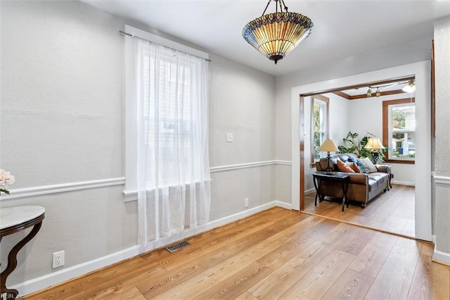 living area with hardwood / wood-style floors