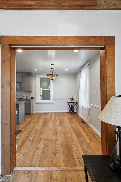 unfurnished living room with light wood-type flooring