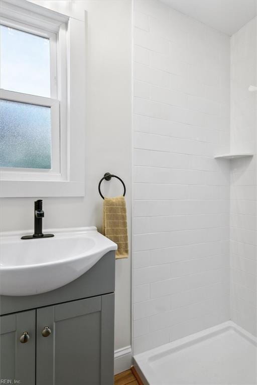 bathroom featuring vanity and a shower