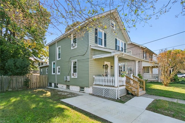 view of front property with a front lawn and covered porch