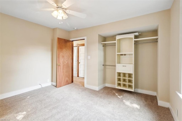 unfurnished bedroom featuring light carpet and ceiling fan