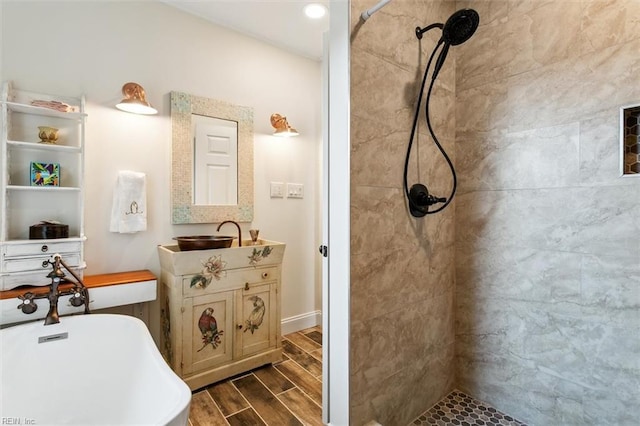 bathroom featuring vanity and separate shower and tub