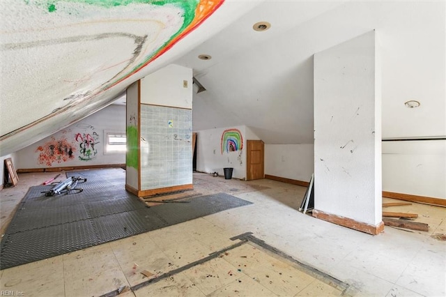 additional living space with vaulted ceiling