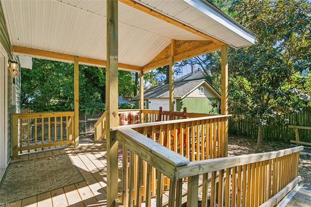 wooden deck featuring a shed