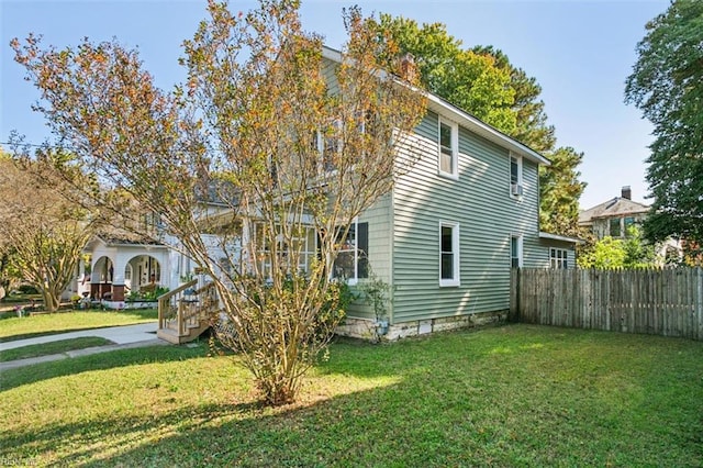 view of home's exterior with a yard