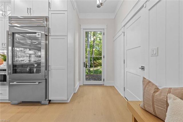 entryway with light hardwood / wood-style flooring