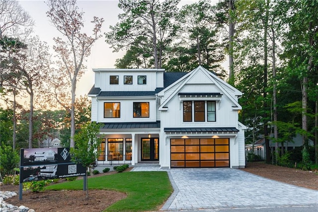 modern farmhouse style home with a garage