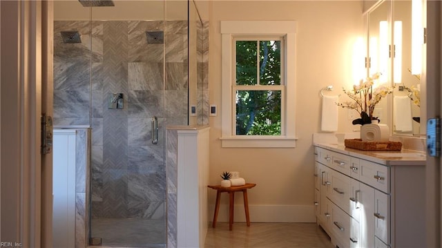 bathroom featuring vanity and a shower with shower door