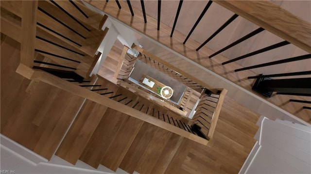 stairway featuring wood-type flooring