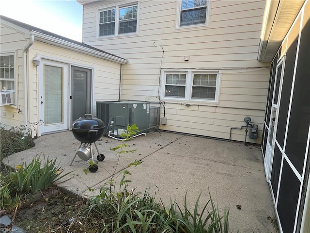 view of patio with area for grilling and cooling unit