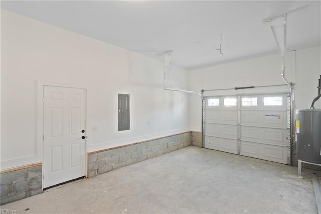 garage with electric panel and water heater