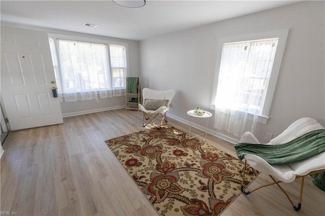 sitting room featuring light hardwood / wood-style flooring