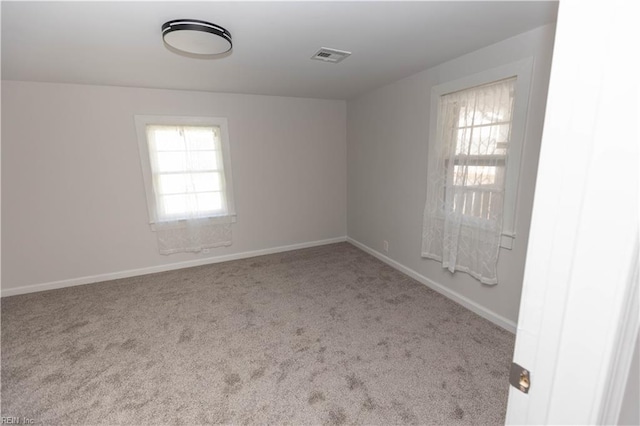 empty room featuring light carpet