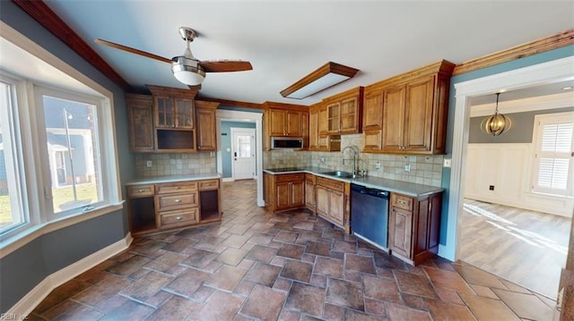 kitchen featuring decorative backsplash, stainless steel appliances, sink, and decorative light fixtures