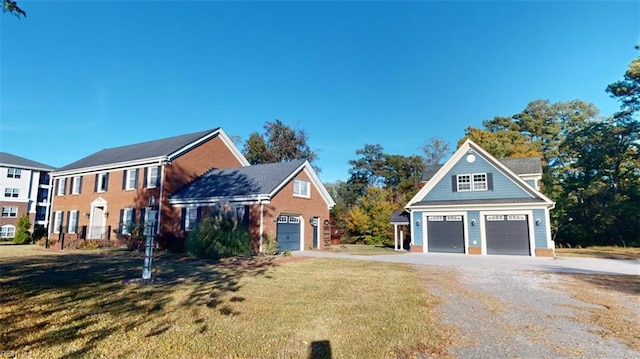 view of front facade with a garage and a front lawn