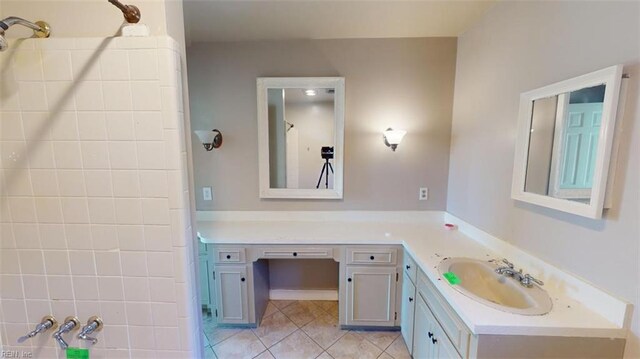 bathroom with vanity, a shower, and tile patterned floors