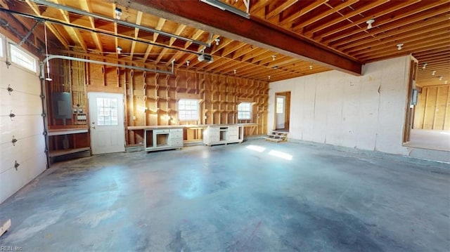 garage featuring a garage door opener and electric panel