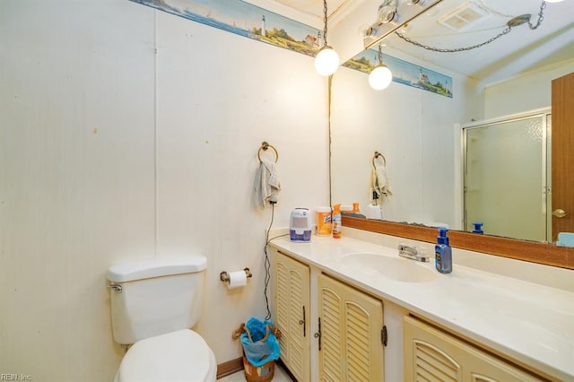 bathroom featuring walk in shower, vanity, and toilet