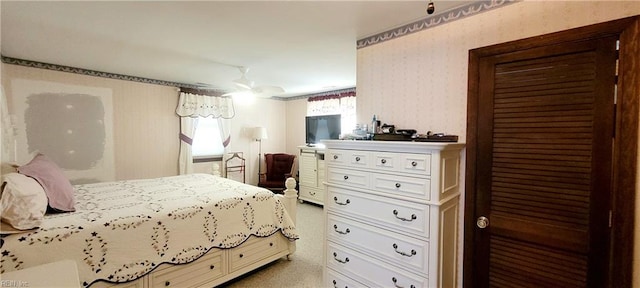 bedroom with light colored carpet