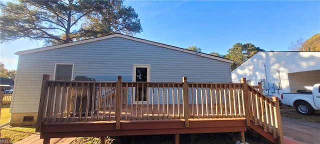 rear view of property with a deck