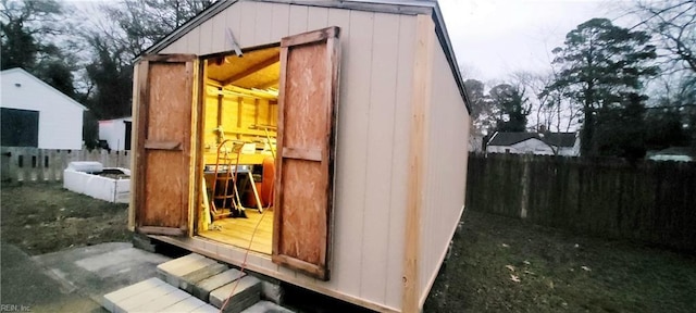 view of outbuilding with a yard