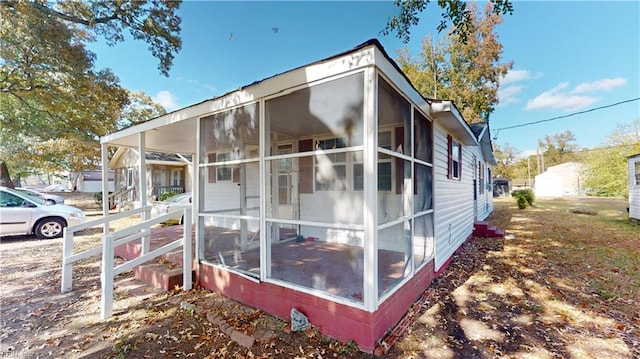 view of home's exterior featuring a sunroom